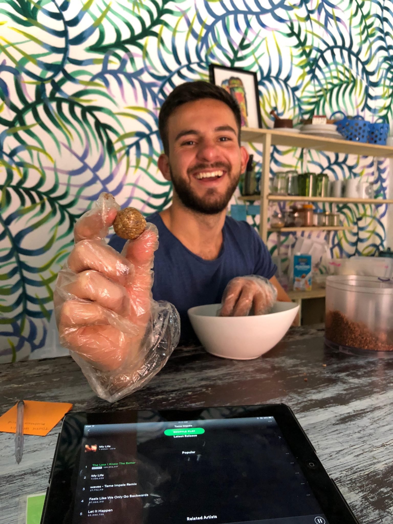 A staff showing an organic, granola energy bite